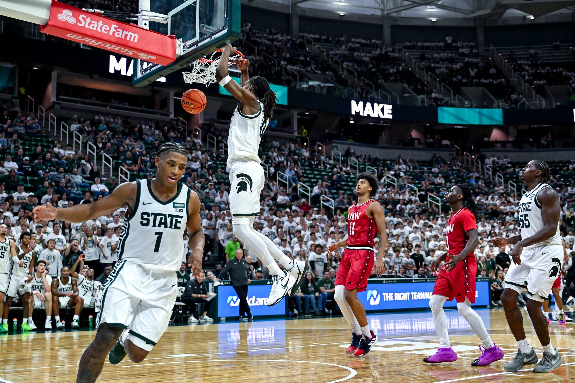 Michigan State’s Ethan Taylor, center, dunks after a Jeremy Fears Jr. assist against Incarnate Word during the second half on Friday, Oct. 2, 2026, at the Breslin Center in East Lansing.