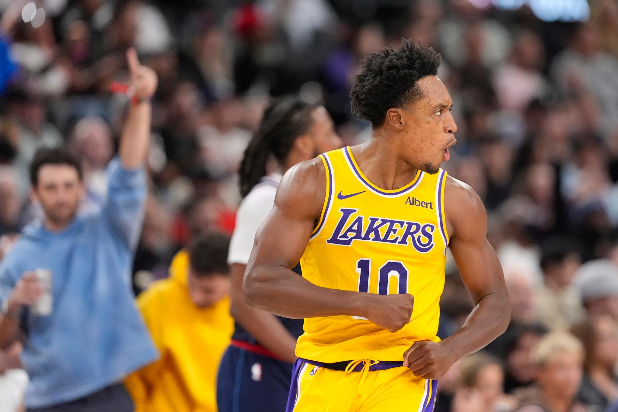 Los Angeles Lakers guard Collin Sexton reacts after scoring during a basketball game.