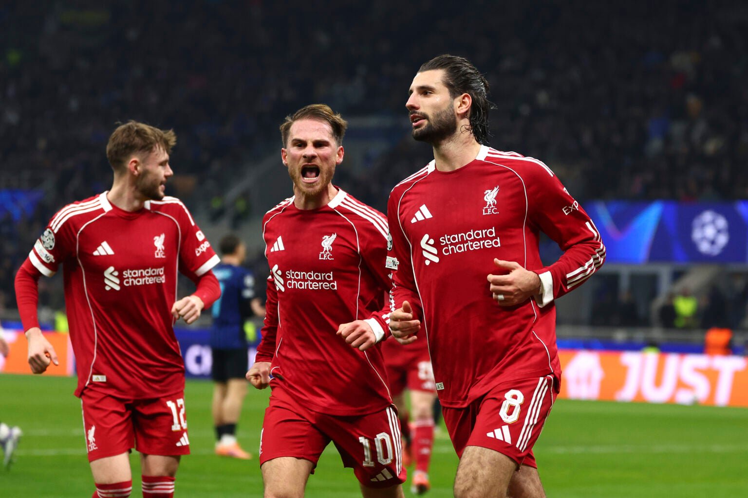 Dominik Szoboszlai, Alexis Mac Allister and Conor Bradley celebrate after Szoboszlai scores during Liverpool's UEFA Champions League match against Inter Milan