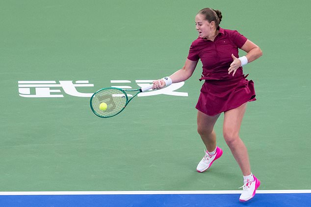 Jelena Ostapenko of Latvia returns the ball against Sonay Kartal of Britain in a women's singles semifinal match during the 2026 Wuhan Open tennis tournament in Wuhan in central China's Hubei Province on Saturday, Oct. 17, 2026. (Chinatopix Via AP)