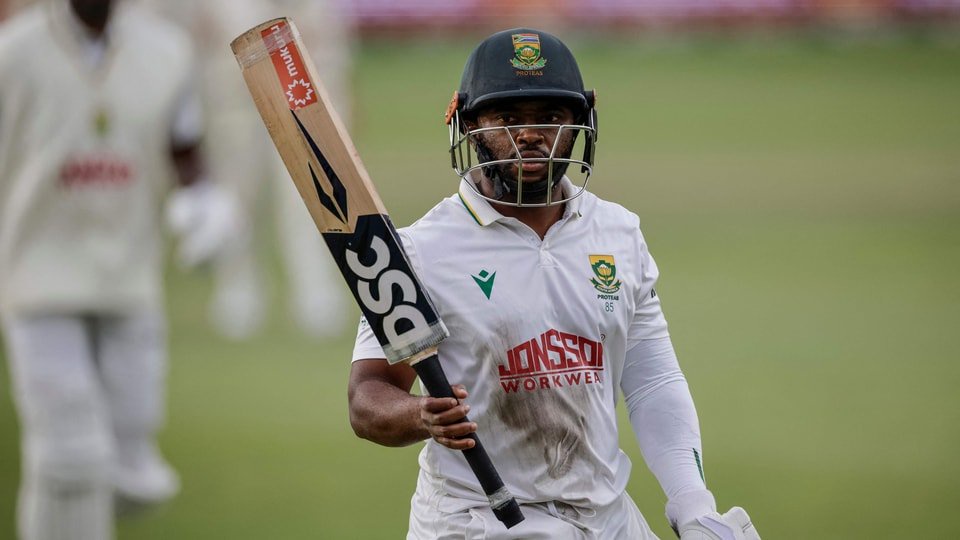South Africa's Temba Bavuma acknowledges the crowd as he walks back to the pavilion following his dismissal on day three of the second Test match between South Africa and Australia at St Georges Park in Gqeberha (AFP)