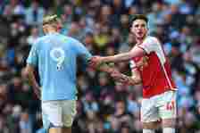 Erling Haaland of Manchester City and Declan Rice of Arsenal FC during the Premier League match between Manchester City and Arsenal FC at Etihad St...