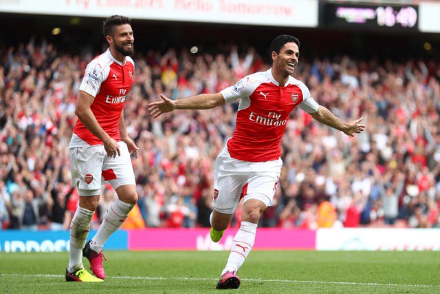 Mikel Arteta (right) celebrates with Olivier Giroud