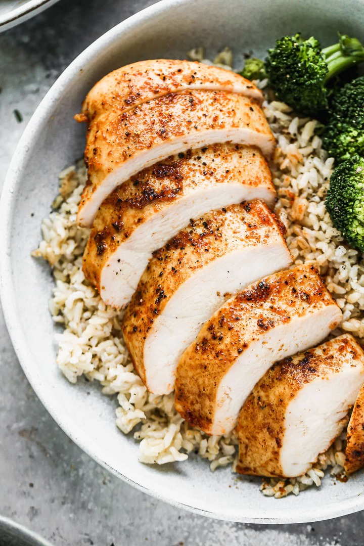 A sliced oven roasted chicken breast in a bowl