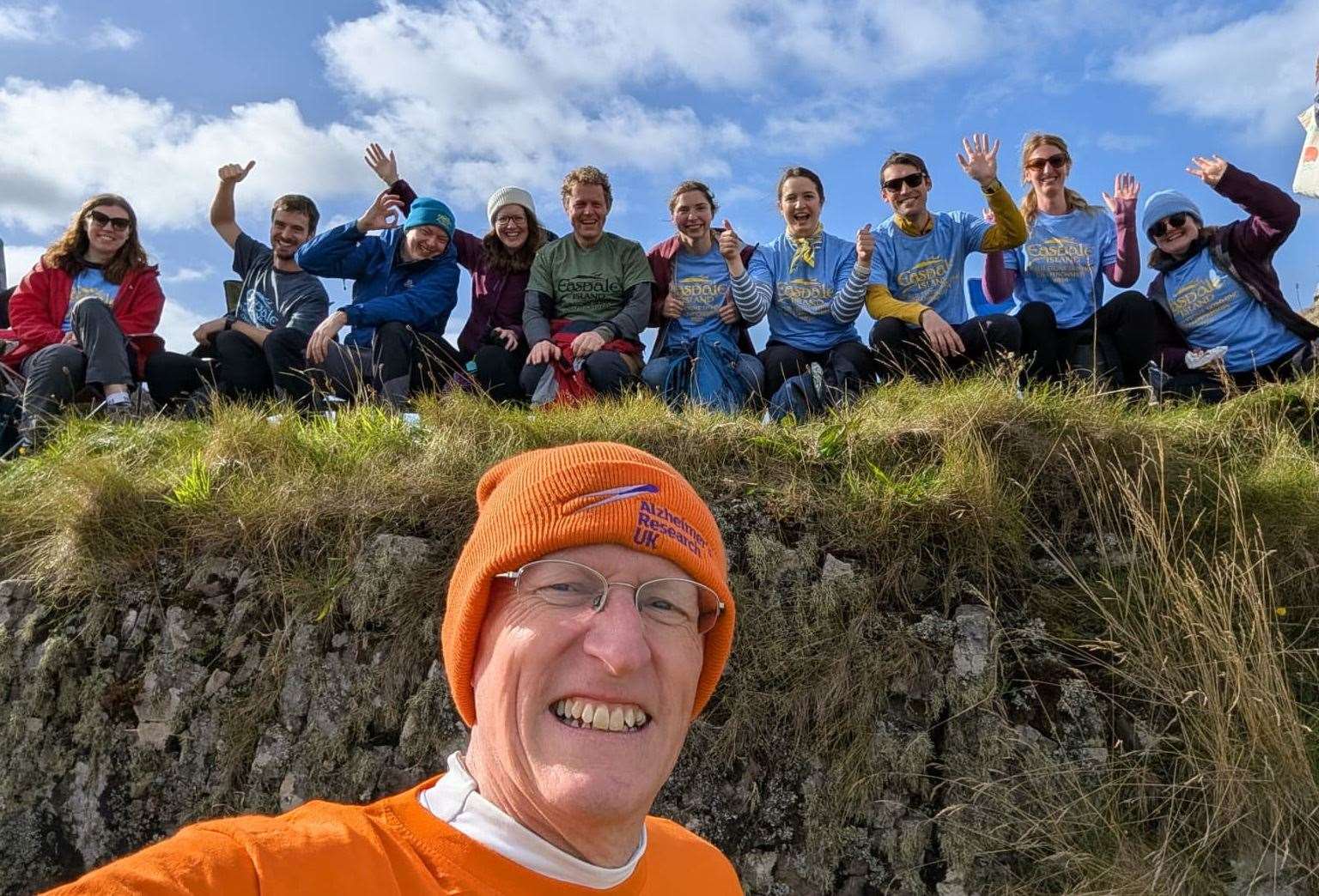 Simon Gibson with the cheer squad who supported his efforts in the World Stone Skimming Championship