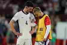 Declan Rice (L) speaks with teammate Jarrod Bowen after the UEFA EURO 2024 group stage match between England and Slovenia at Cologne Stadium on Jun...