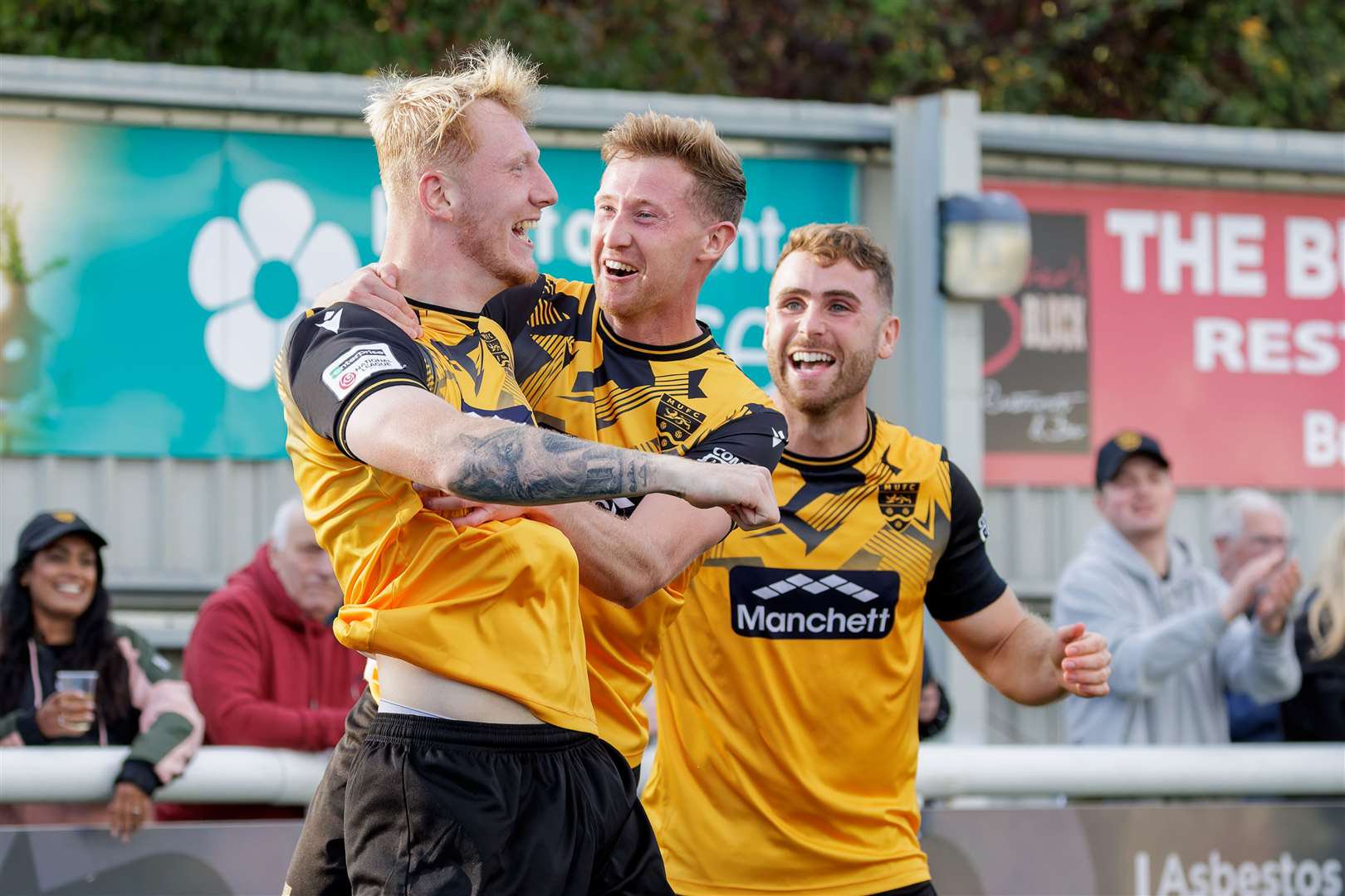 Ryan Hanson, centre, celebrates with goalscorer Taylor Foran during Maidstone's 2-1 win over Maidenhead. Picture: Helen Cooper