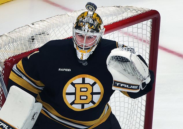 Boston Bruins goalie Jeremy Swayman watches the puck sailing over his head during the first period of an NHL hockey game against the San Jose Sharks, Saturday, Oct. 24, 2026, in Boston. (AP Photo/Jim Davis)