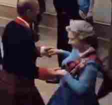 Prince Phillip and Queen Elizabeth take part in the Scottish country dancing called the Eightsome Reel