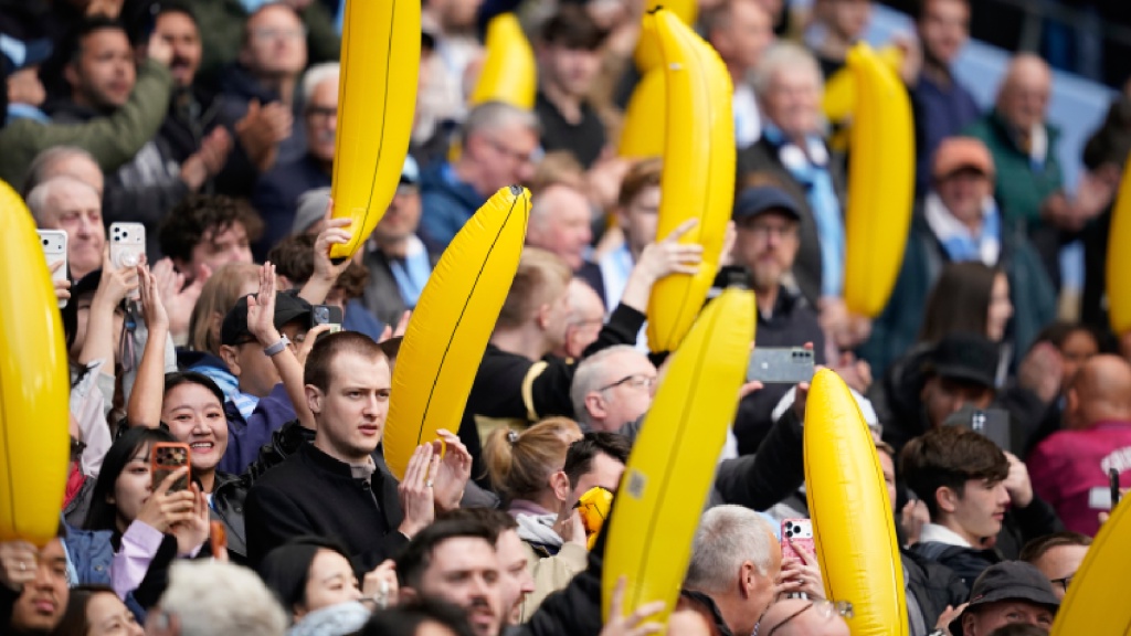 Manchester City fans wave inflatable bananas during the English Premier League soccer match between Manchester City and Ipswich Town, in Manchester, England, Saturday, Oct.17, 2026. (AP Photo/Dave Thompson)