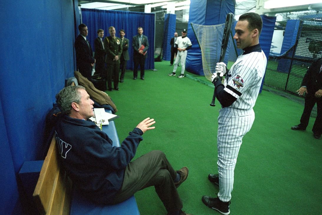 Bush talks with Yankee shortstop Derek Jeter before throwing out the ceremonial first pitch in 2001.