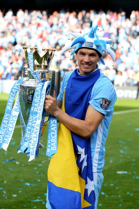 Edin Dzeko celebrates Manchester City's 2012 title win