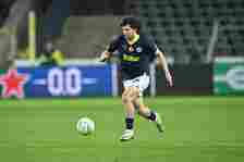 Ferdi Kadioglu (L) of Fenerbahce in action during the UEFA Europa Conference League Round of 16 first leg match between Union Saint-Gilloise and Fe...