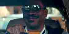 Eddie Murphy rides in a car with his sunglasses on in Beverly Hills Cop: Axel F still