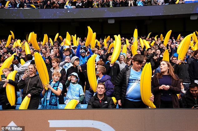 Manchester City fans with inflatable bananas in the stands ahead of the Premier League match against Ipswich (Martin Rickett/PA)