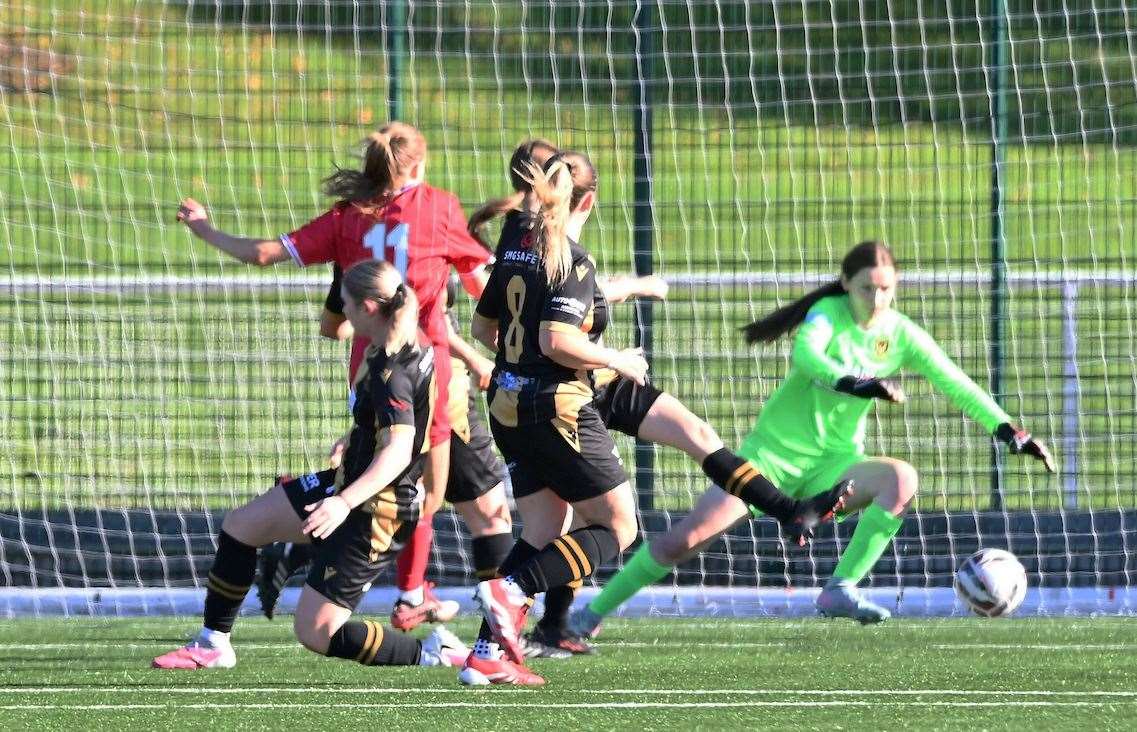 Huntly 'keeper Summer Simson dives to make a save from Airdrie's Kirsty Gilbert. Photo: Ger Harley/Sportpix