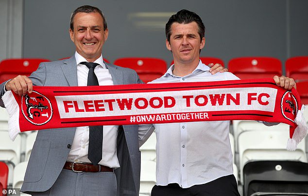 Mr Pilley pictured holding a club scarf with Joey Barton when he became manager of Fleetwood Town