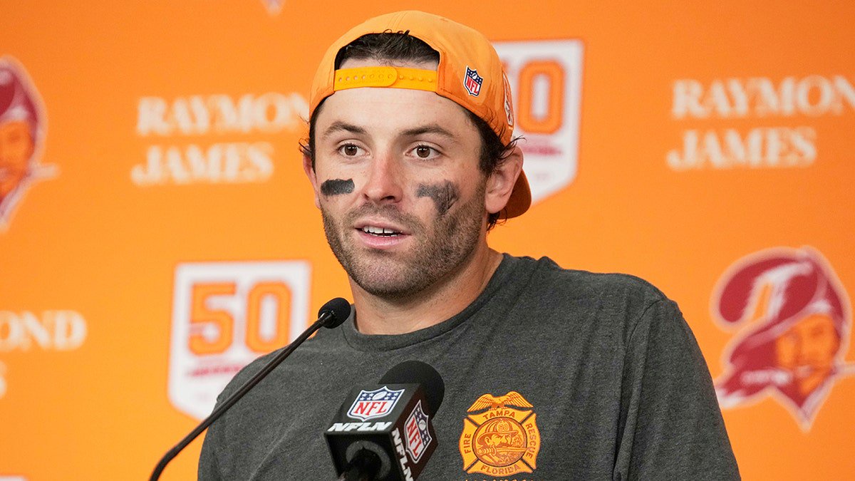 Baker Mayfield talks to reporters