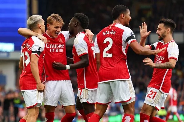 Arsenal players celebrate after Leandro Trossard scored against Everton at Goodison Park.