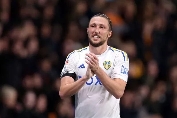 Luke Ayling claps the fans