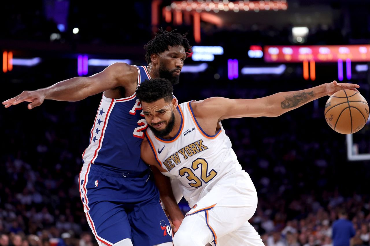 Joel Embiid (l.) and Karl-Anthony Towns in action on Tuesday, Oct. 20, 2026.Credit: Sarah Stier/Getty