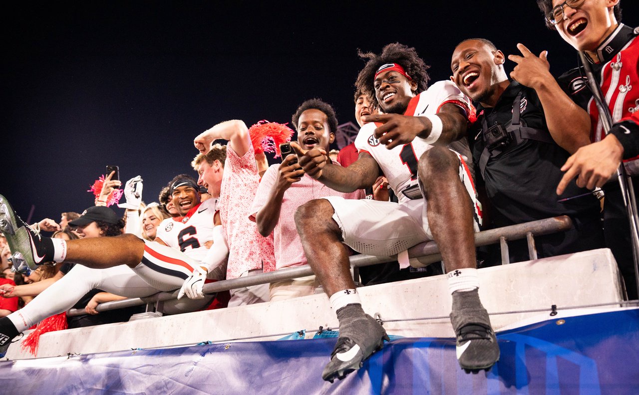 Georgia players celebrate with fans after Georgia defeated Florida 24-20 in an NCAA football game, Saturday, Nov. 1, 2025, at EverBank Stadium in Jacksonville, Fla. [Doug Engle/Florida Times-Union]