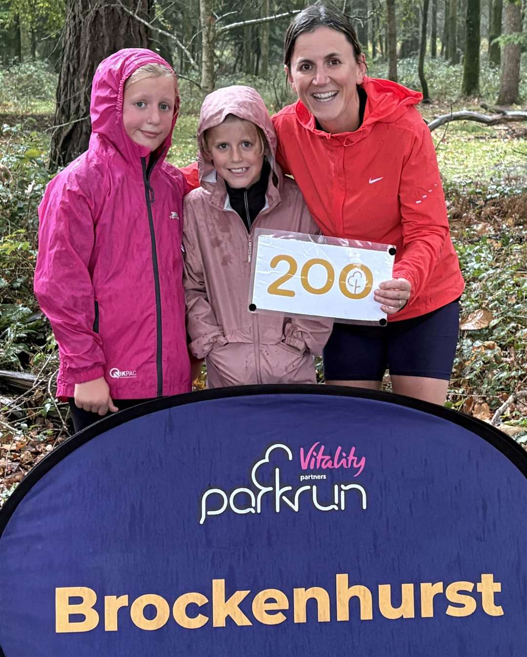 Emma Greenhough celebrates her 200th parkrun with her daughters.