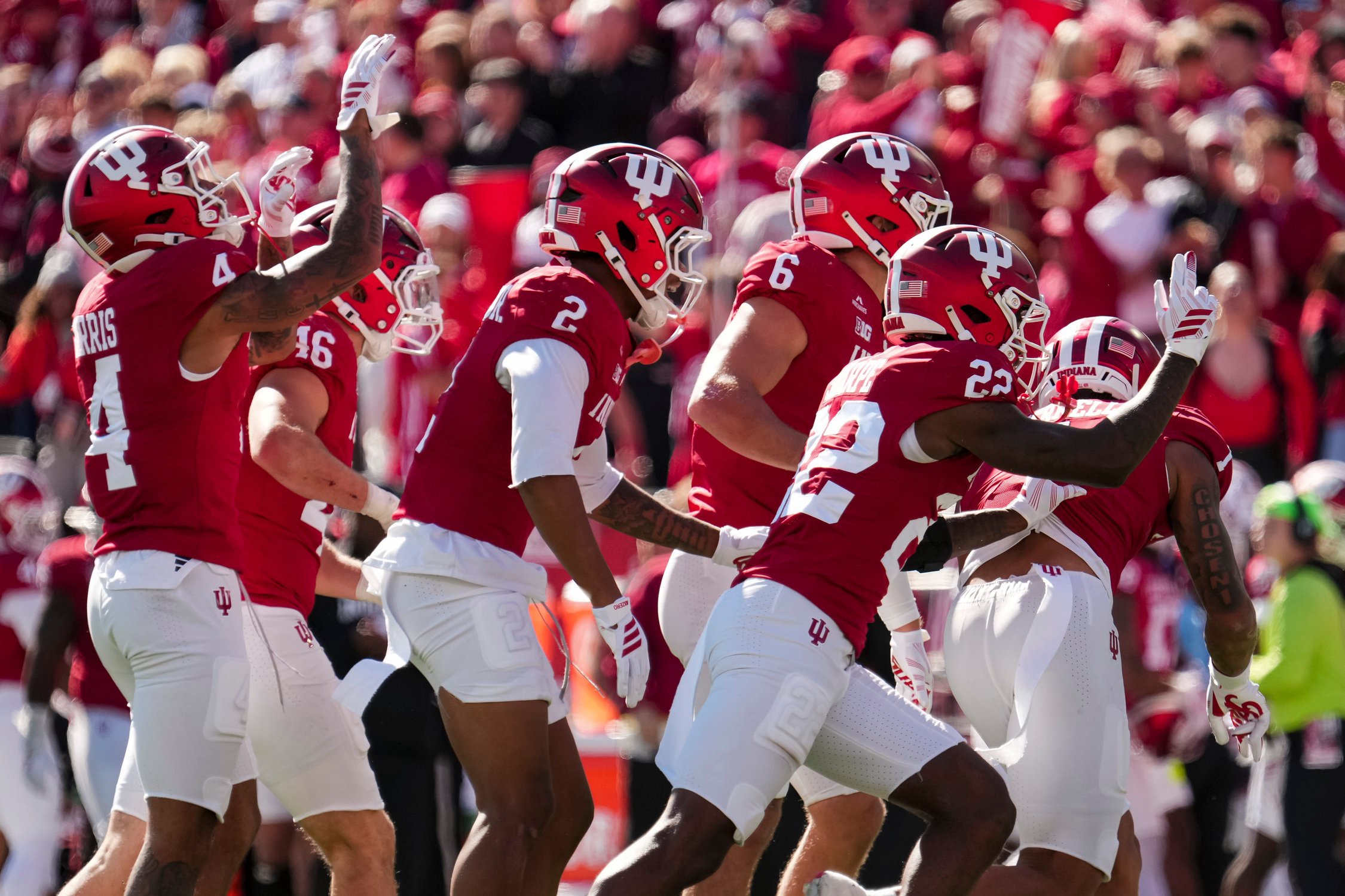 Indiana Hoosiers players celebrate during the NCAA football game against the Ohio State Buckeyes at Memorial Stadium Stadium in Bloomington, Ind. on Oct. 17, 2026.