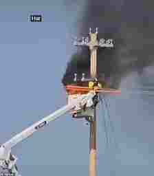 The power lineman can be seen trapped between the flame and a bucket truck in a YouTube video