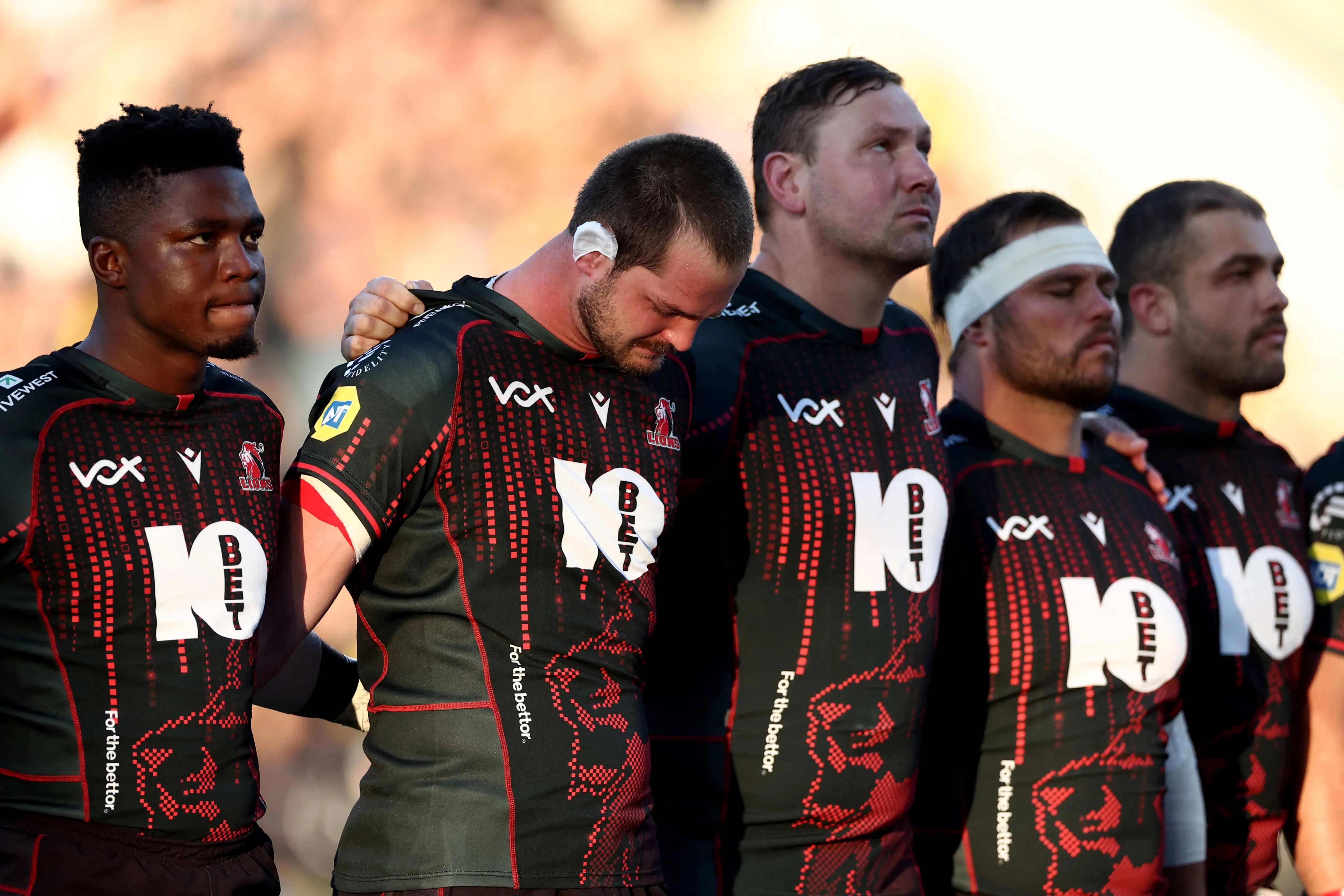 Lions players observe a moment of silence in honour of their teammate Hyron Andrews, ahead of the European Rugby Champions Cup rugby union match against La Rochelle