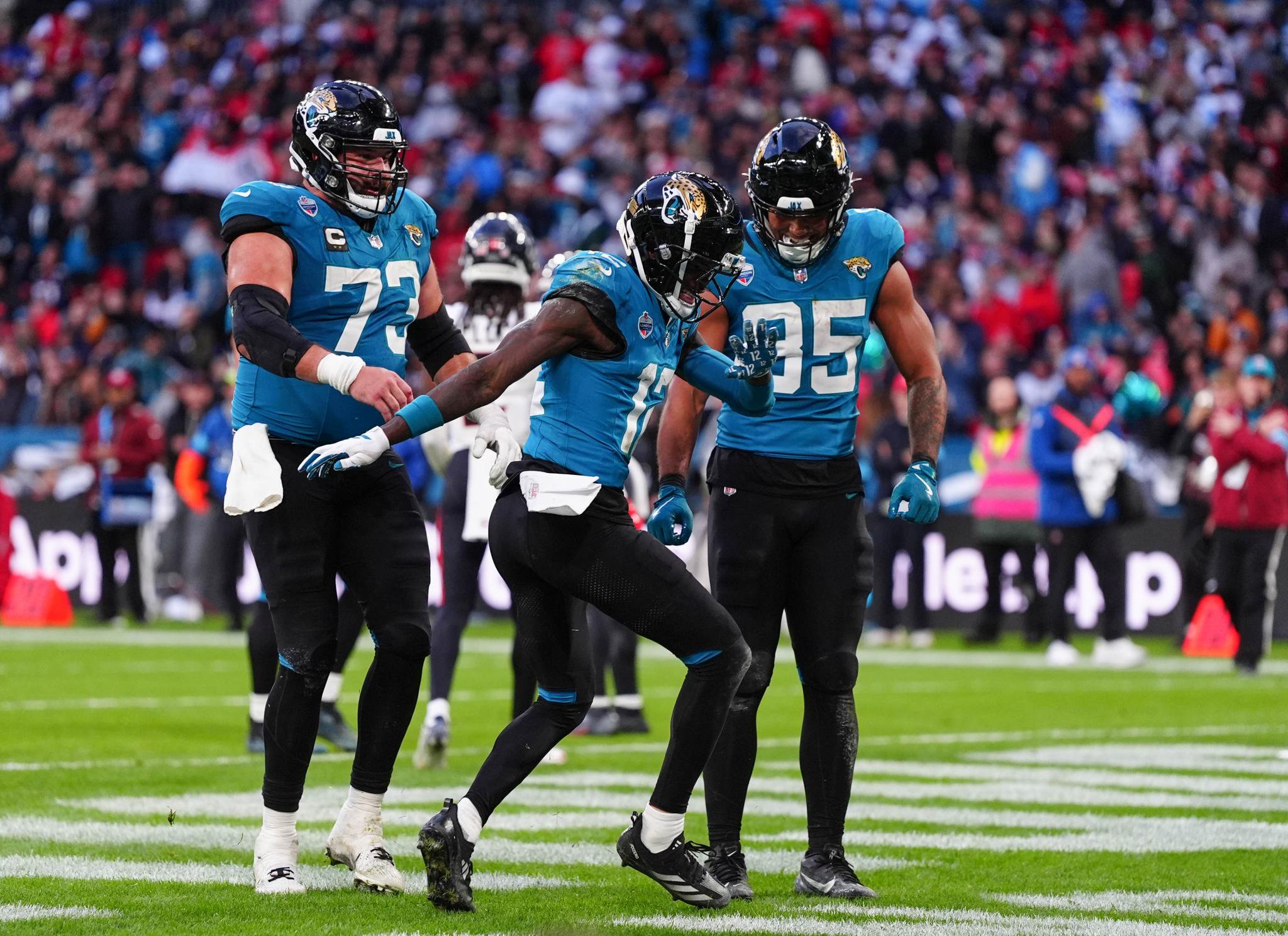 Jacksonville Jaguars' Travis Hunter (centre) celebrates with team mates after scoring a touchdown during the NFL London Games match at Wembley Stadium, London. 