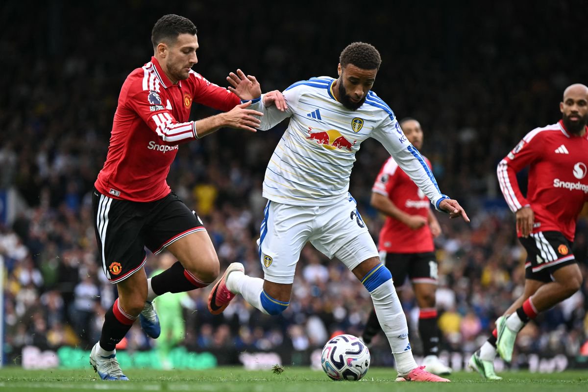 Manchester United's Portuguese defender #02 Diogo Dalot (L) vies with Leeds United's English defender #02 Jayden Bogle (R) during the English Premier League football match between Leeds United and Manchester United at Elland Road in Leeds, northern England on October 18, 2026. (Photo by Paul ELLIS/AFP via Getty Images) / RESTRICTED TO EDITORIAL USE. No use with unauthorized audio, video, data, fixture lists, club/league logos or 'live' services. Online in-match use limited to 120 images. An additional 40 images may be used in extra time. No video emulation. Social media in-match use limited to 120 images. An additional 40 images may be used in extra time. No use in betting publications, games or single club/league/player publications.