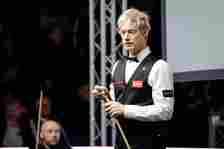 Neil Robertson of Australia chalks the cue in the third round match against Zak Surety of England on day eight of 2024 World Championship Qualifiers at the English Institute of Sport on April 15, 2024 in Sheffield, England.