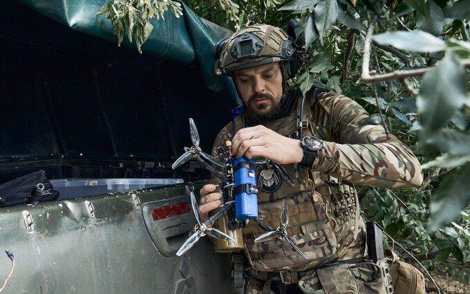 A Ukrainian soldier prepares a drone on the frontline in the Zaporizhzhia region of southeast Ukraine