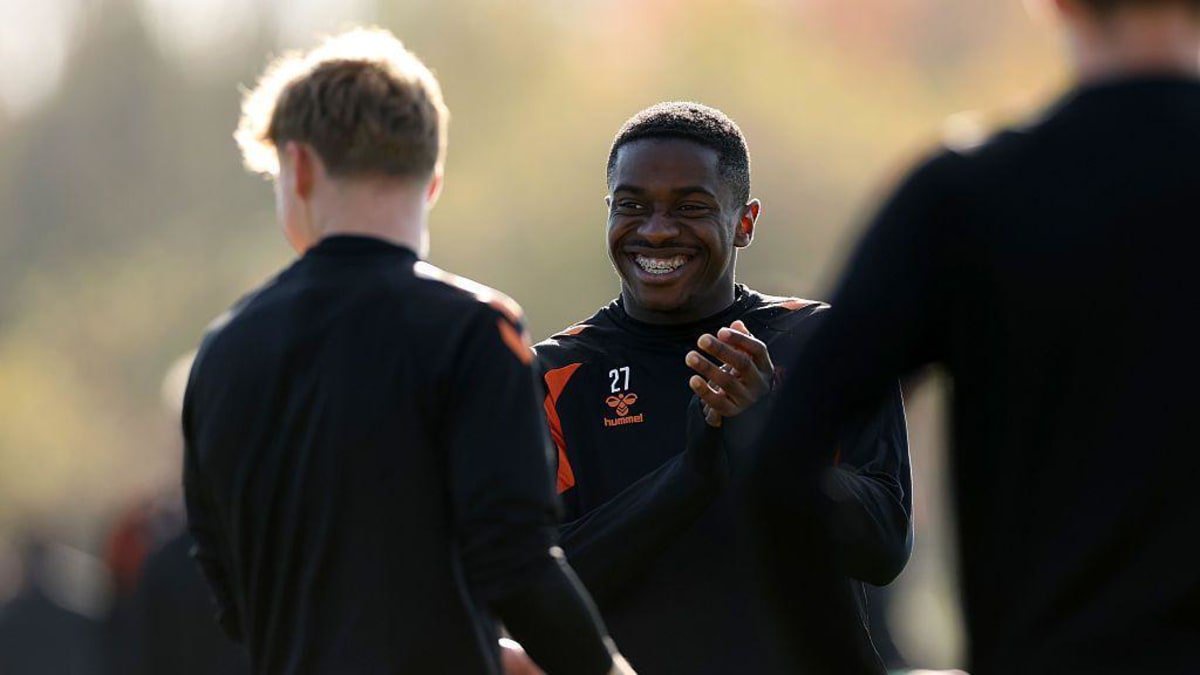 Noah Sadiki of Sunderland laughs with his team-mates during a training session