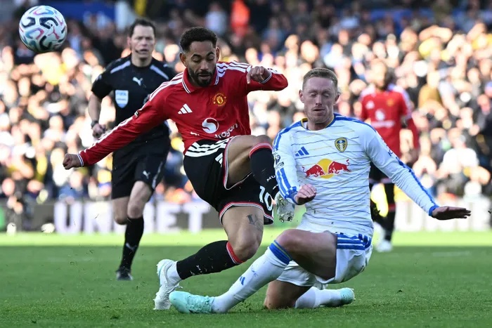 IN THE THICK OF IT: Matheus Cunha is tackled by Sean Longstaff 