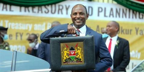 Treasury Cabinet Secretary Ukur Yatani poses for a photo with the famous budget breif case outside parliament buildings on Thursday, April 7 ,2022..jpg (44