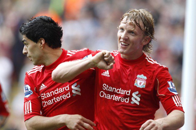Liverpool's Dirk Kuyt (right) celebrates scoring their second goal of the game with team-mate Luis Suarez (left) during the Barclays Premier League match at Anfield, Liverpool. PRESS ASSOCIATION Photo. Picture date: Saturday April 23, 2011. See PA story SOCCER Liverpool. Photo credit should read: Peter Byrne/PA Wire. RESTRICTIONS: Use subject to restrictions. Editorial print use only except with prior written approval. New media use requires licence from Football DataCo Ltd. Call +44 (0)1158 447447 or see www.pressassociation.com/images/restrictions for full restrictions.