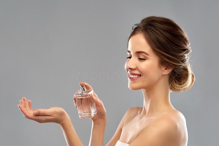 Happy Woman with Perfume Over Gray Background Stock Image - Image of person, gorgeous: 139087317