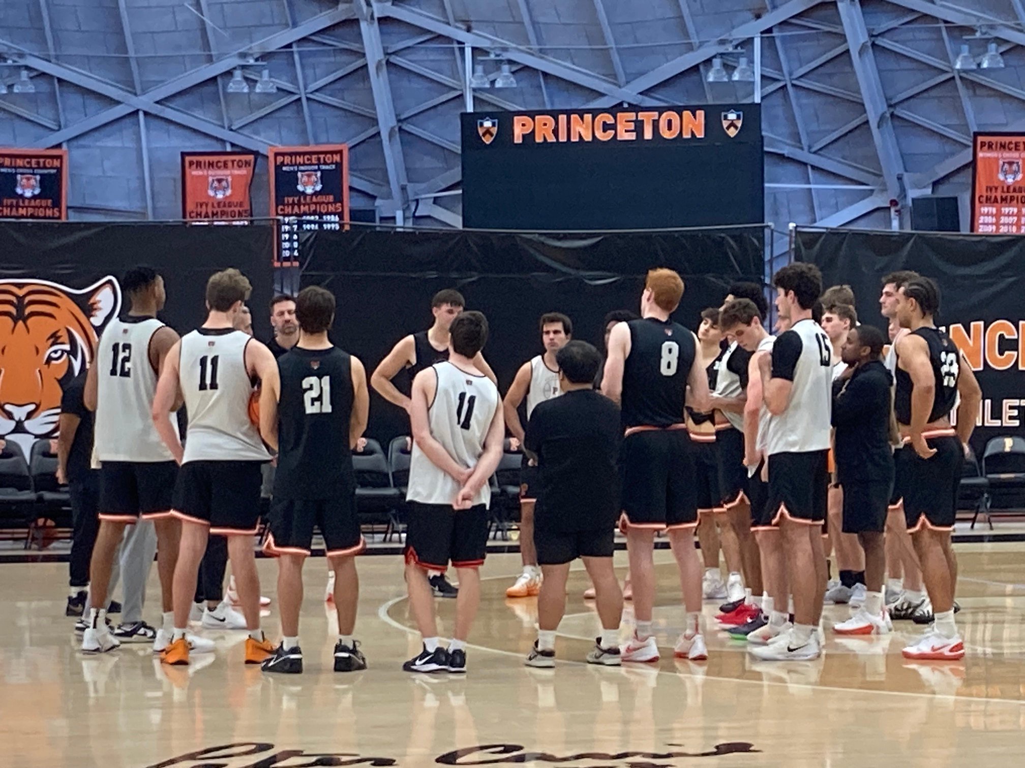 Princeton basketball players huddle during a preseason practice Oct. 21, 2026