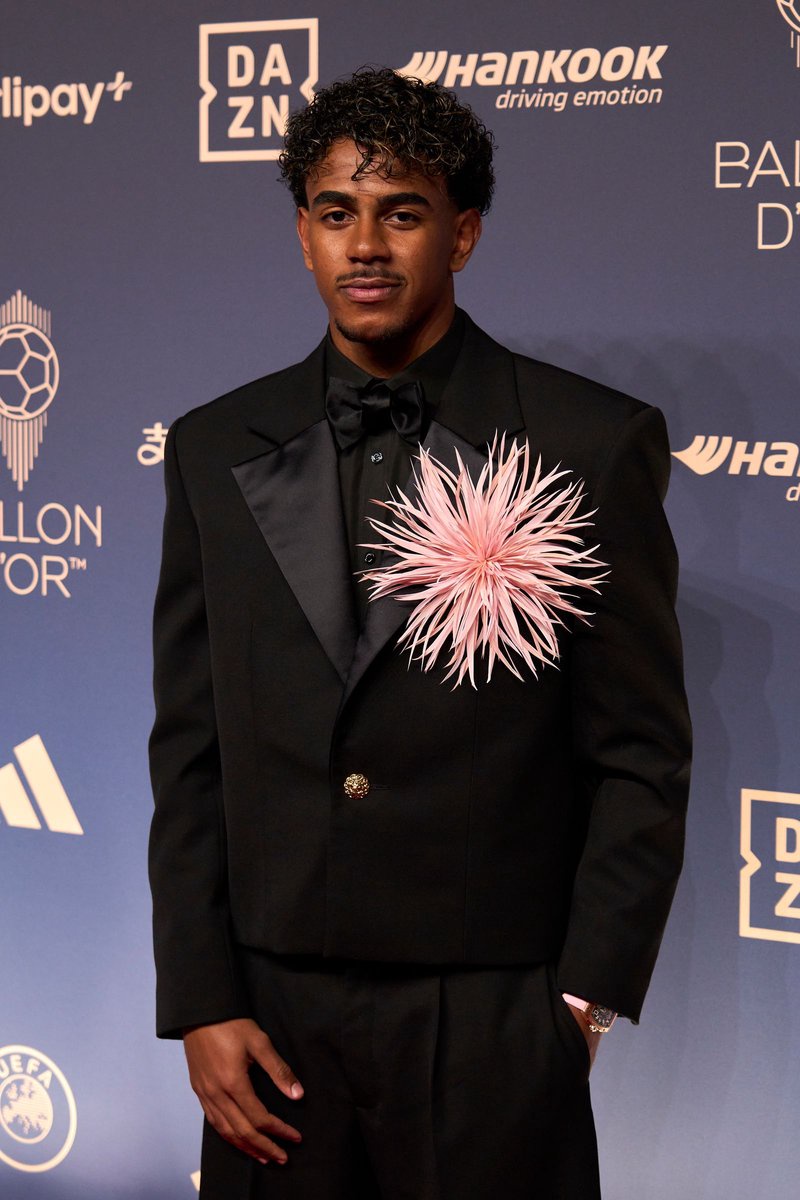 Image may contain Francisco Lindor Clothing Formal Wear Suit Blazer Coat Jacket Head Person Face Adult and Tuxedo
