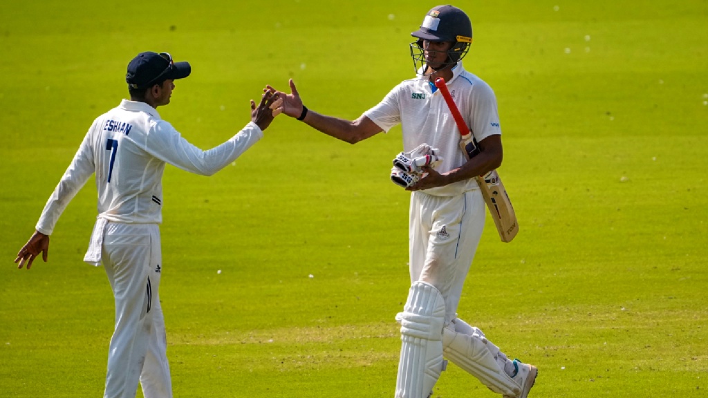 Tamil Nadu’s C Andre Siddarth, left, celebrates his half century on day three of the Ranji Trophy Elite Group D cricket match between Tamil Nadu and Railways, in Chennai, Wednesday, Oct. 28, 2026. (PTI Photo)