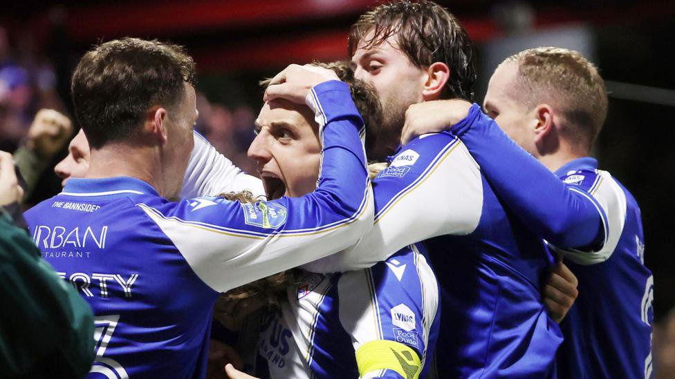 Coleraine celebrate Joel Cooper's winning goal