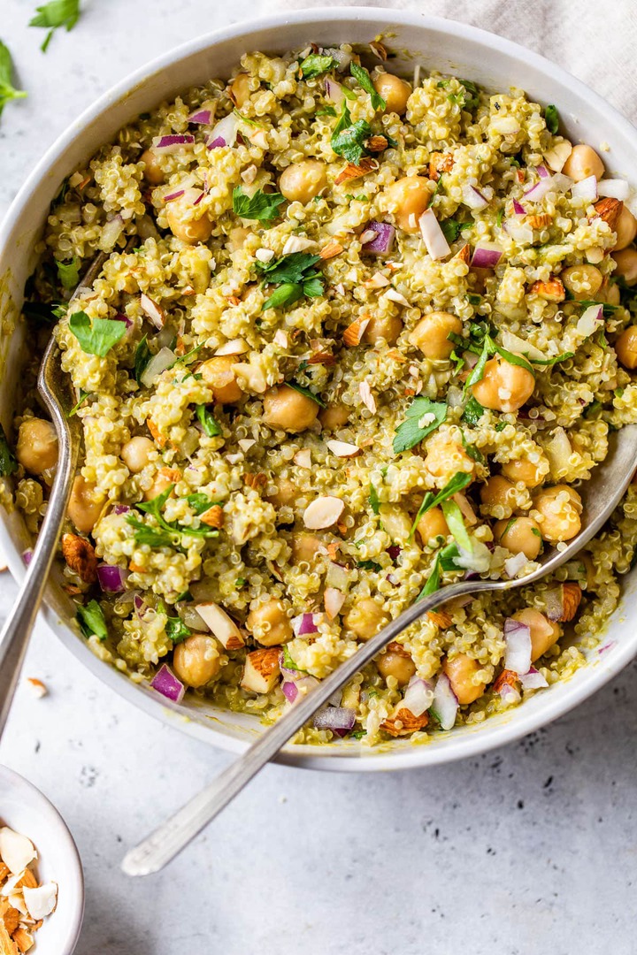 Quinoa chickpea salad in a bowl with red onions