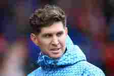 John Stones of Manchester City takes his place in the dugout during the Premier League match between Nottingham Forest and Manchester City at City ...