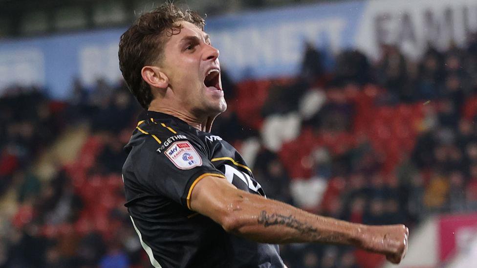 Newport County forward Harrison Biggins celebrates