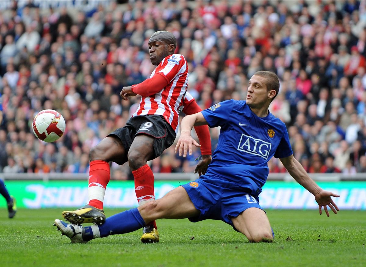 Djibril Cisse of Sunderland and Nemanja Vidic of Manchester United challenge during the Premier League match between Sunderland and Manchester United at Stadium Of Light on April 11, 2009 in Sunderland, England.