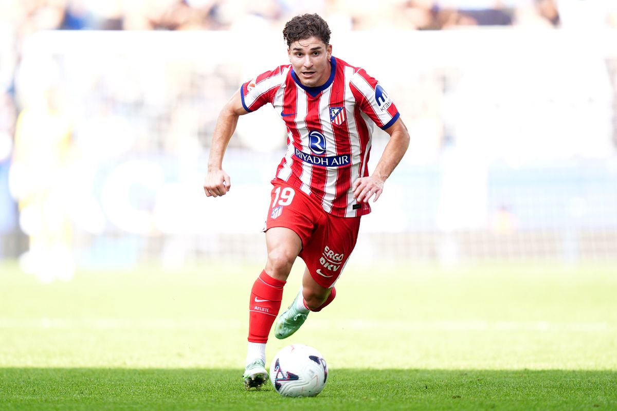 Julian Alvarez runs with the ball