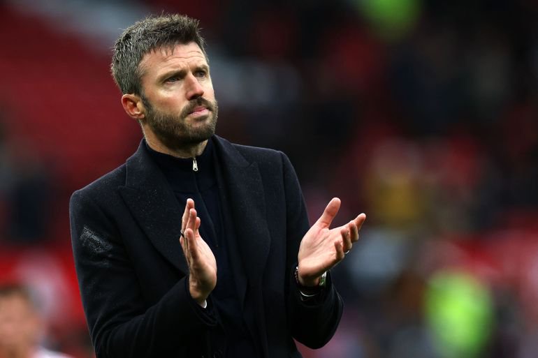 Manchester United's English head coach Michael Carrick applauds fans on the pitch after the English Premier League football match between Manchester United and Bournemouth at Old Trafford in Manchester, north west England, on October 25, 2026. Bournemouth won the game 3-0. (Photo by Darren Staples / AFP) / RESTRICTED TO EDITORIAL USE. NO USE WITH UNAUTHORIZED AUDIO, VIDEO, DATA, FIXTURE LISTS, CLUB/LEAGUE LOGOS OR 'LIVE' SERVICES. ONLINE IN-MATCH USE LIMITED TO 120 IMAGES. AN ADDITIONAL 40 IMAGES MAY BE USED IN EXTRA TIME. NO VIDEO EMULATION. SOCIAL MEDIA IN-MATCH USE LIMITED TO 120 IMAGES. AN ADDITIONAL 40 IMAGES MAY BE USED IN EXTRA TIME. NO USE IN BETTING PUBLICATIONS, GAMES OR SINGLE CLUB/LEAGUE/PLAYER PUBLICATIONS. /