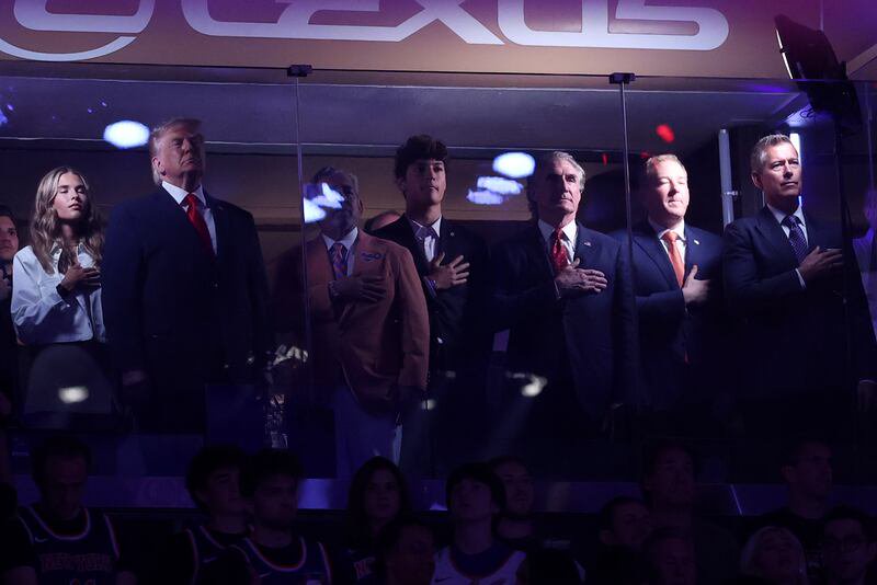 Jun 8, 2026; New York, New York, USA; President Donald Trump (L) stands with New York Knicks owner James Dolan (M-L) and members of his cabinet in a suite during the national anthem prior to game three of the 2026 NBA Finals between the Knicks and San Antonio Spurs at Madison Square Garden. Mandatory Credit: Geoff Burke-Imagn Images